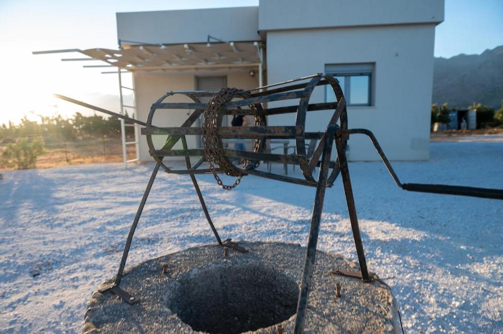 Traditional stone well in Villa Akalli garden, Sfakia, Crete